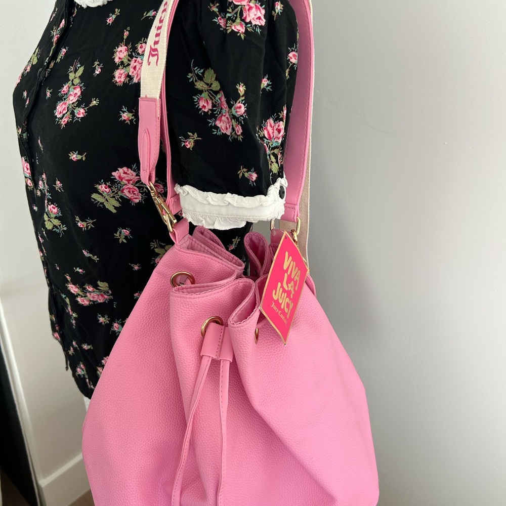 Juicy Couture Pink Shoulder Bag with adjustable Cream Crossbody strap.
